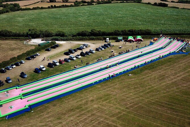 A monster 360ft long slip and slide session in BUDE, Cornwall - Inflatable rings vs bodyboards: picking the ride style that fits your group
