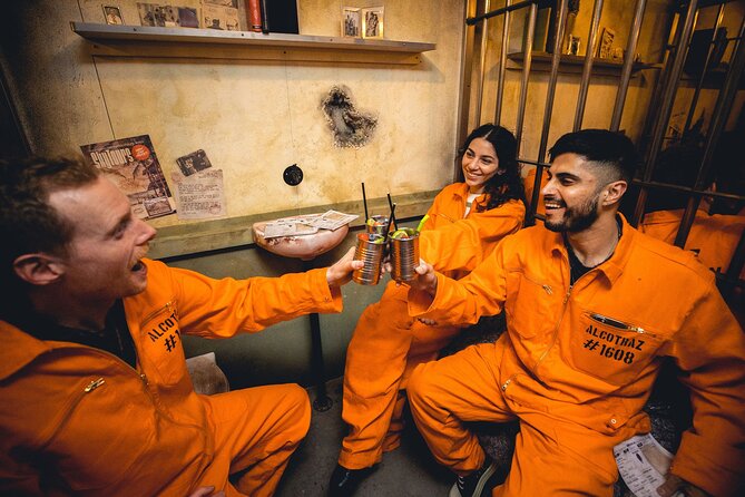 Alcotraz Prison Cocktail Experience in London - Entering Alcotraz: orange jumpsuits, metallic cells, and a real cell-block mood
