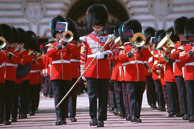 Changing of the Guard Walking Tour in London at Buckingham Palace - Meeting at Victoria Palace Theatre (watch for the yellow umbrella)