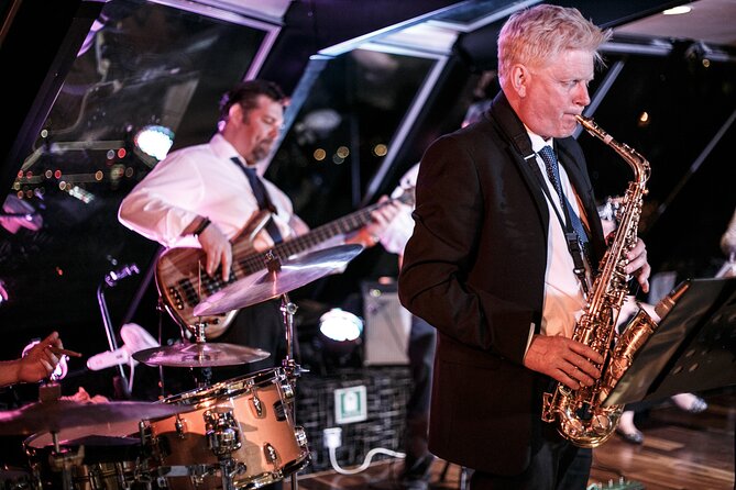 Dinner and Jazz Cruise on the River Thames - Royal Naval Museum battleship: the curve where history feels present