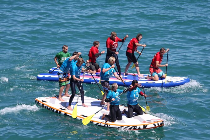Giant Stand Up Paddle Boarding Experience in Newquay - The 2-Hour Rhythm: From Surf School to Coves and Caverns