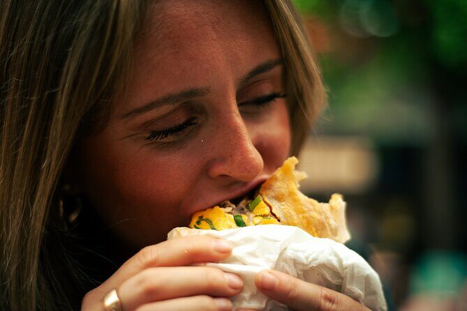 Hungry for Soho: London's Finest Food Tour - Soho tastings: welcome drink, Indian food, and the “how do they fit it all in?” feeling