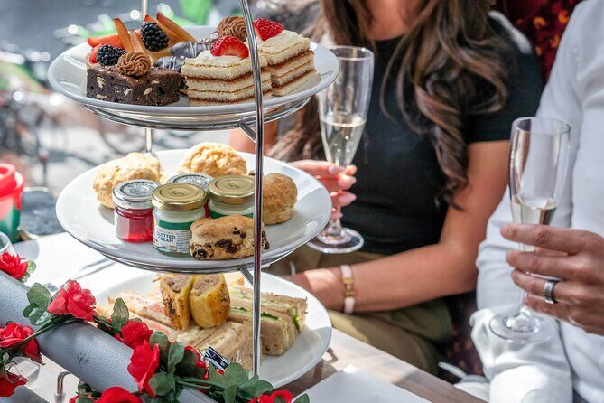 London: Afternoon Tea Bus Tour with Prosecco & London Eye Option - Afternoon tea on the move: scones, sandwiches, and that onboard chef