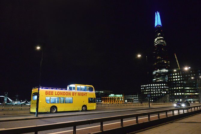 London by Night Sightseeing Tour - Open Top Bus - Along the Thames: boats, reflections, and a sense of direction