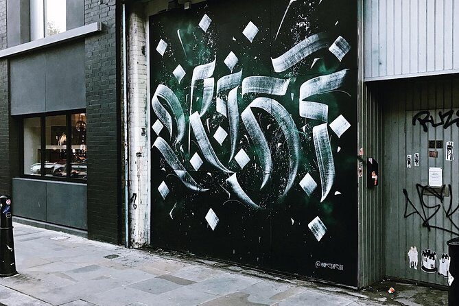 London Street Art Tour of the East End Exclusive Walking Tour - Old Spitalfields Market: Victorian halls and modern shopping energy