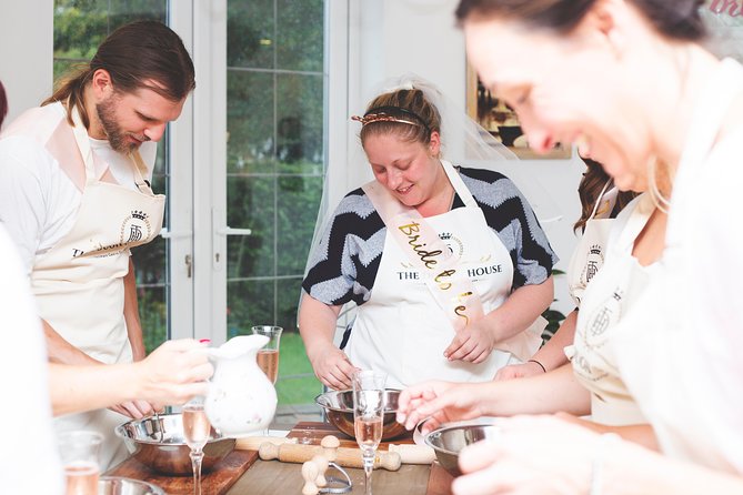 Pasta Making Experience - Cooking Class - What happens after cooking: wine bottle, table setup, and a meal under the floral roof
